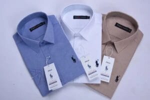 WhatsApp Image 2026-07-14 at 14.14.36 (2) pack de 3 chemises Ralph lauren Oxford demi manche Ref-CH71001D ( Blanche + Beige + Bleu roi )
